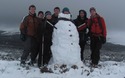 Groepsfoto met sneeuwman